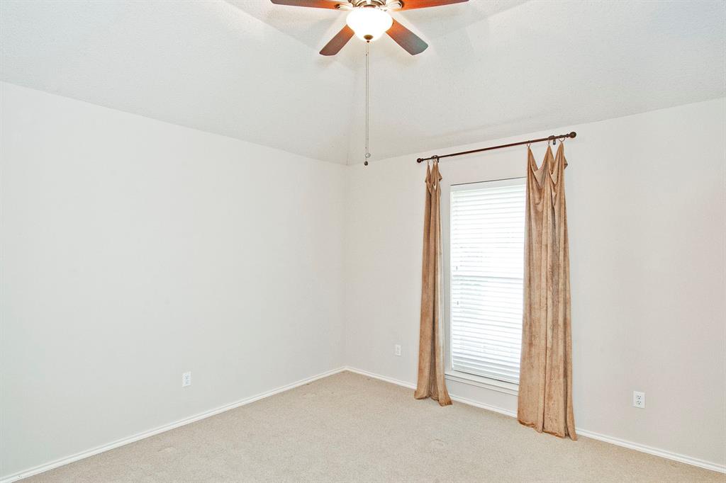 7757 Lancelot Road Frisco, TX 75035 - Photo 25 of 27 Spare room with light carpet, a healthy amount of sunlight, lofted ceiling, and ceiling fan