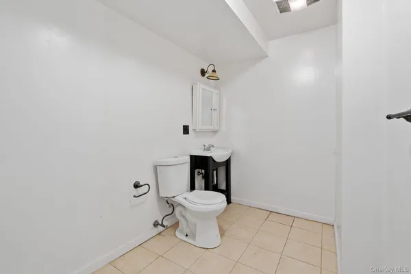 a bathroom with a toilet and a sink