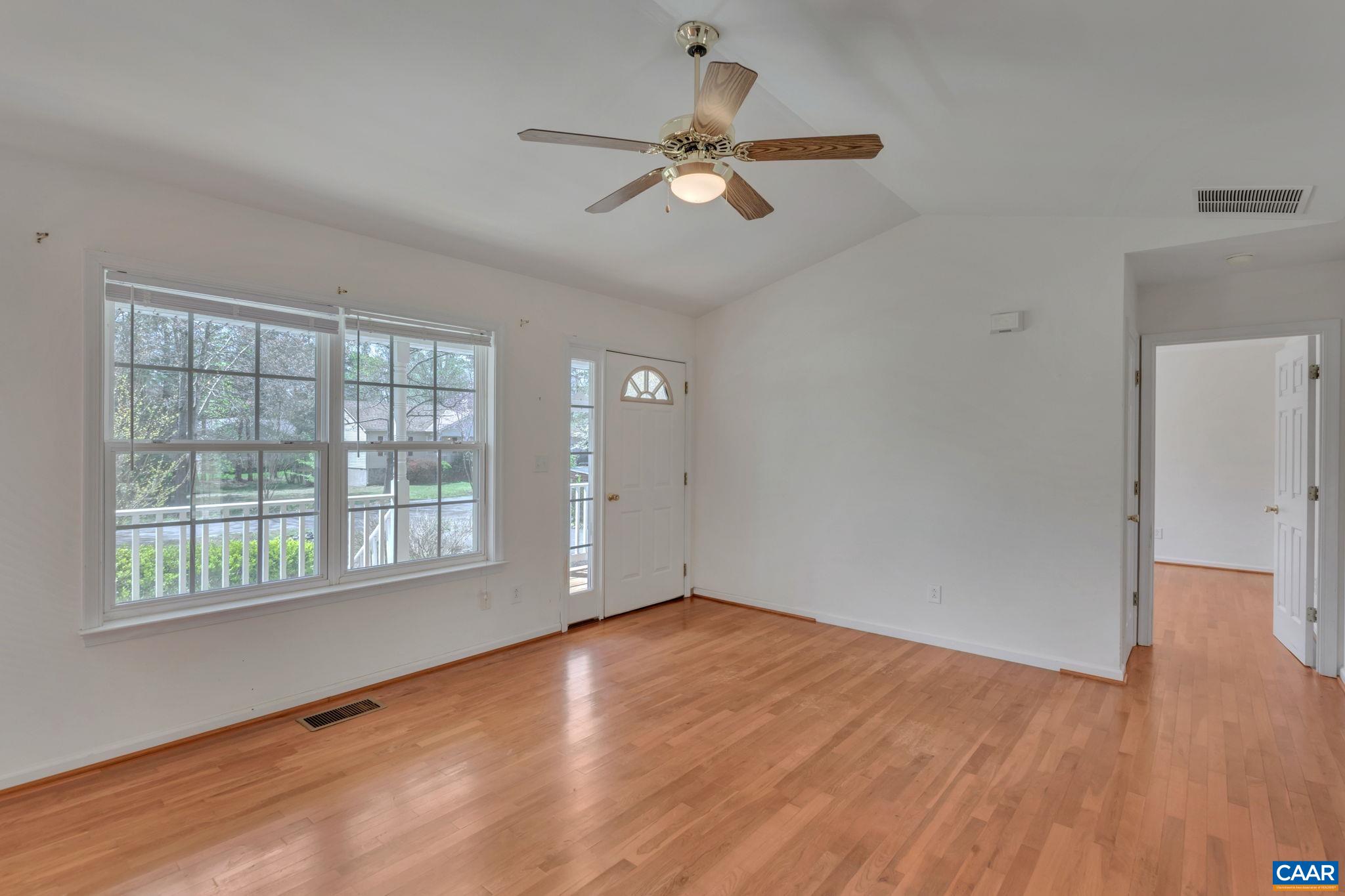 18 Loblolly Road Palmyra, VA 22963 - Photo 11 of 41 an empty room with wooden floor fan and windows
