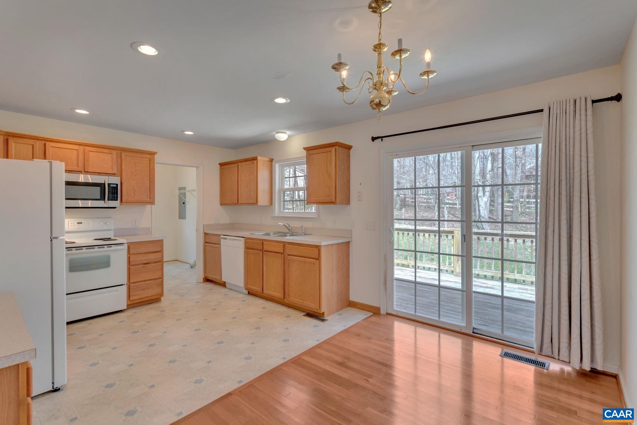 18 Loblolly Road Palmyra, VA 22963 - Photo 18 of 41 a large kitchen with kitchen island a large window and stainless steel appliances