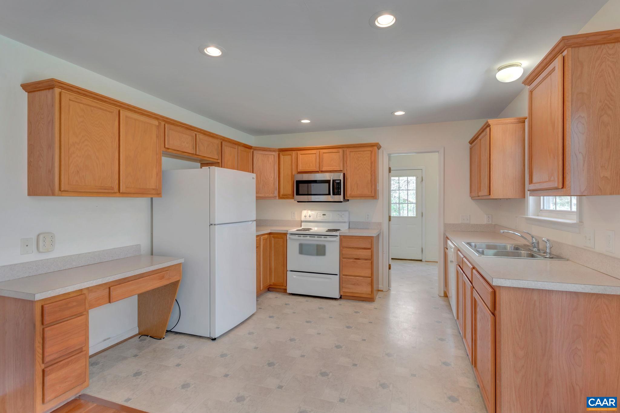 18 Loblolly Road Palmyra, VA 22963 - Photo 19 of 41 a kitchen with stainless steel appliances granite countertop a refrigerator sink and stove