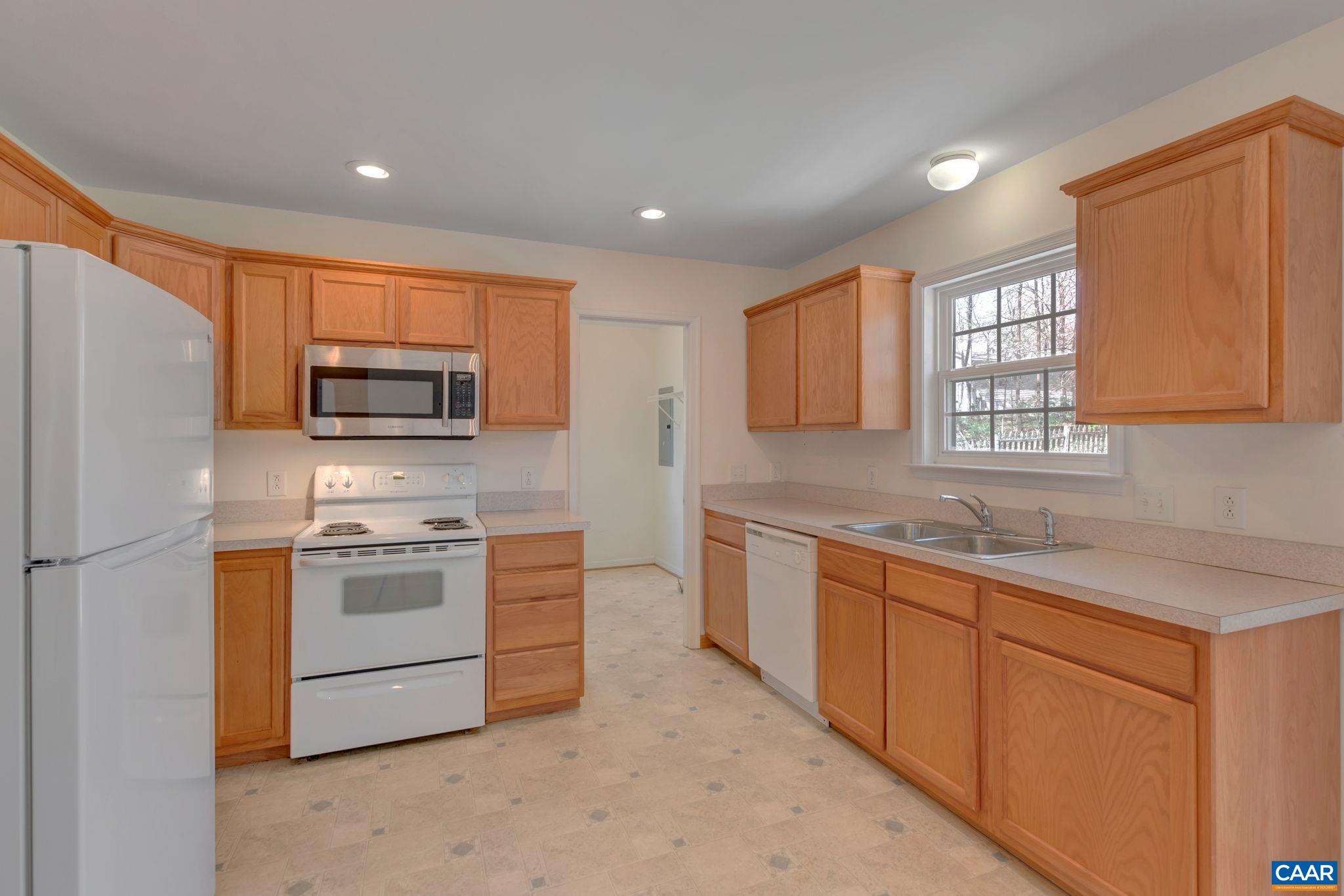 18 Loblolly Road Palmyra, VA 22963 - Photo 20 of 41 a kitchen with stainless steel appliances granite countertop a stove a sink dishwasher a refrigerator and a microwave oven