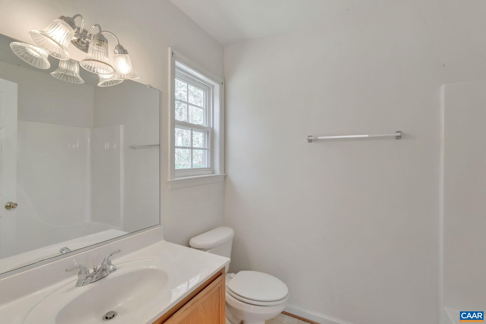 18 Loblolly Road Palmyra, VA 22963 - Photo 25 of 41 a bathroom with a sink vanity mirror and toilet