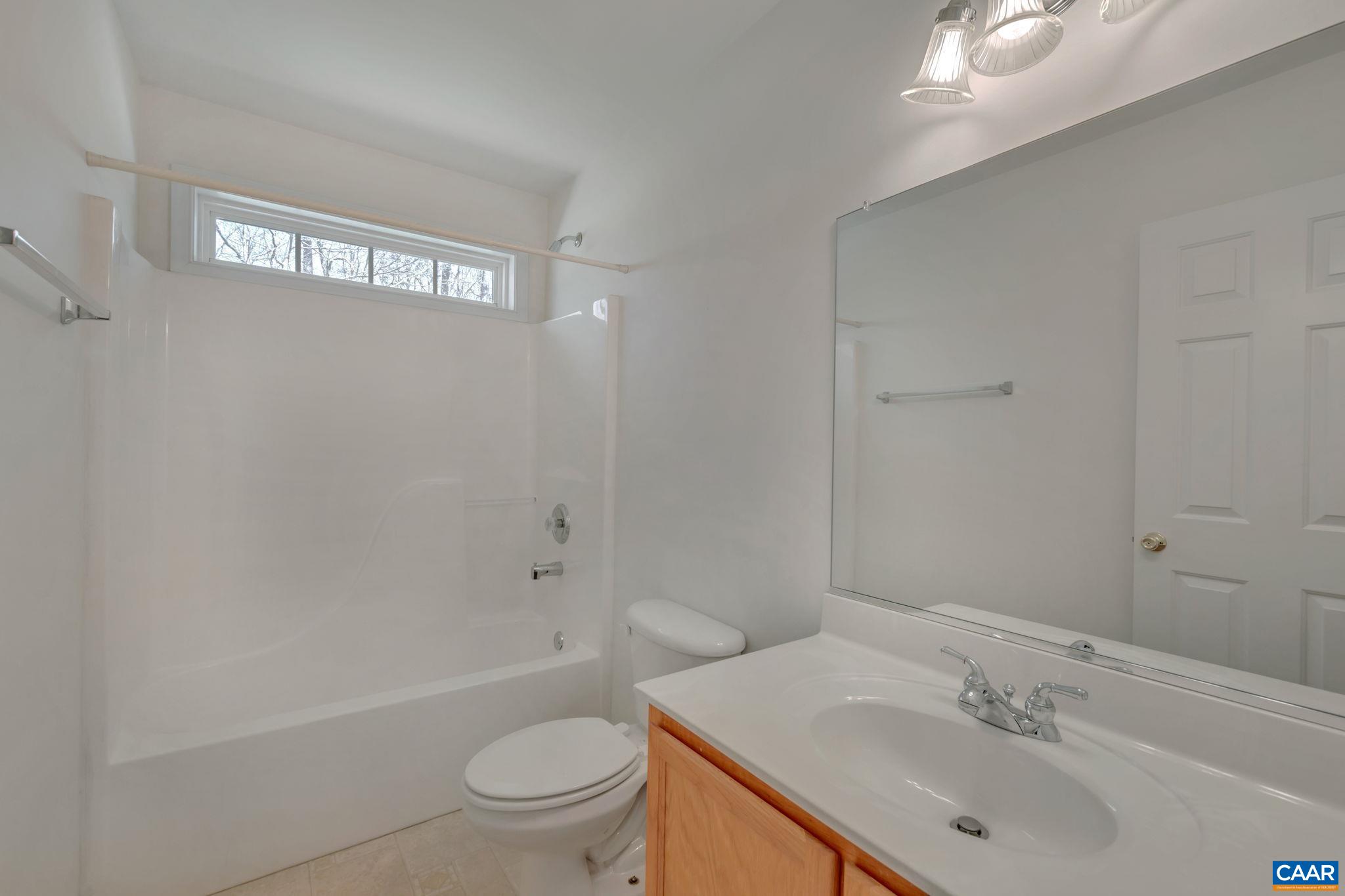 18 Loblolly Road Palmyra, VA 22963 - Photo 27 of 41 a bathroom with a sink a toilet and shower