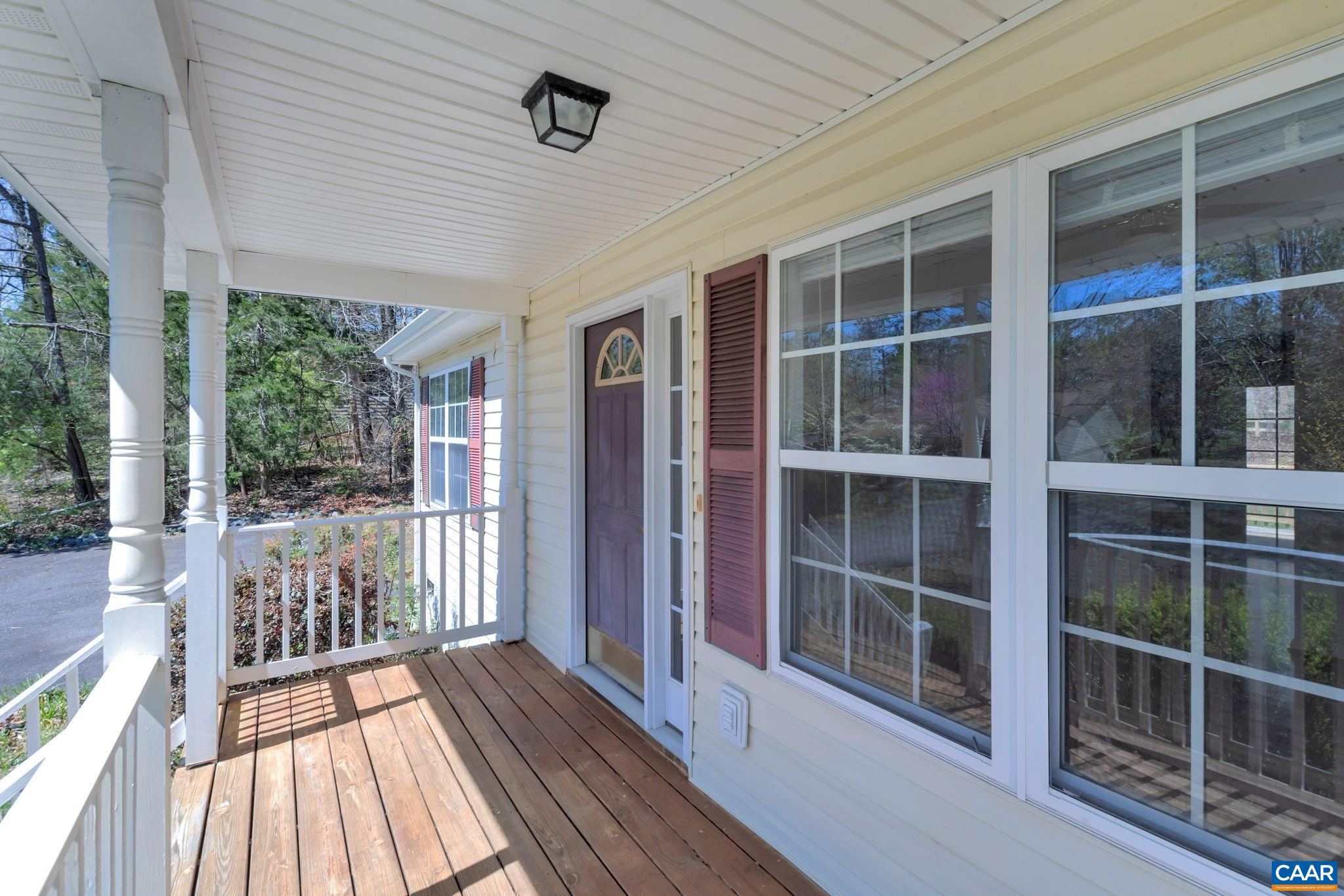 18 Loblolly Road Palmyra, VA 22963 - Photo 3 of 41 a view of a balcony with wooden floor and floor to ceiling window