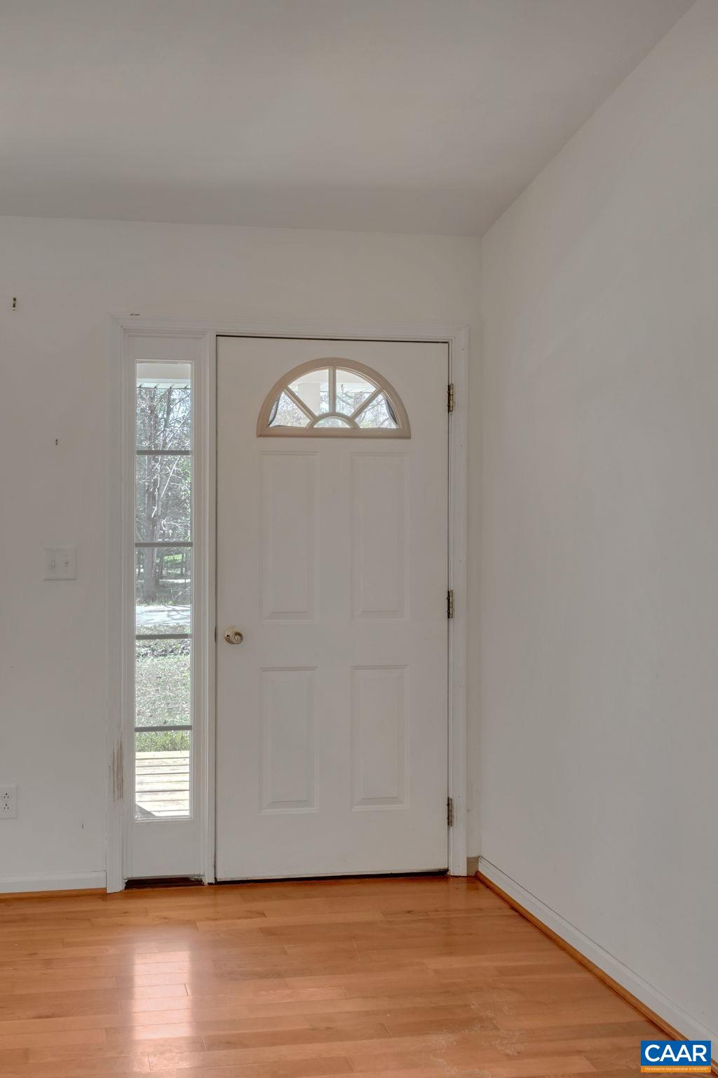 18 Loblolly Road Palmyra, VA 22963 - Photo 7 of 41 a view of an empty room with wooden floor and a window
