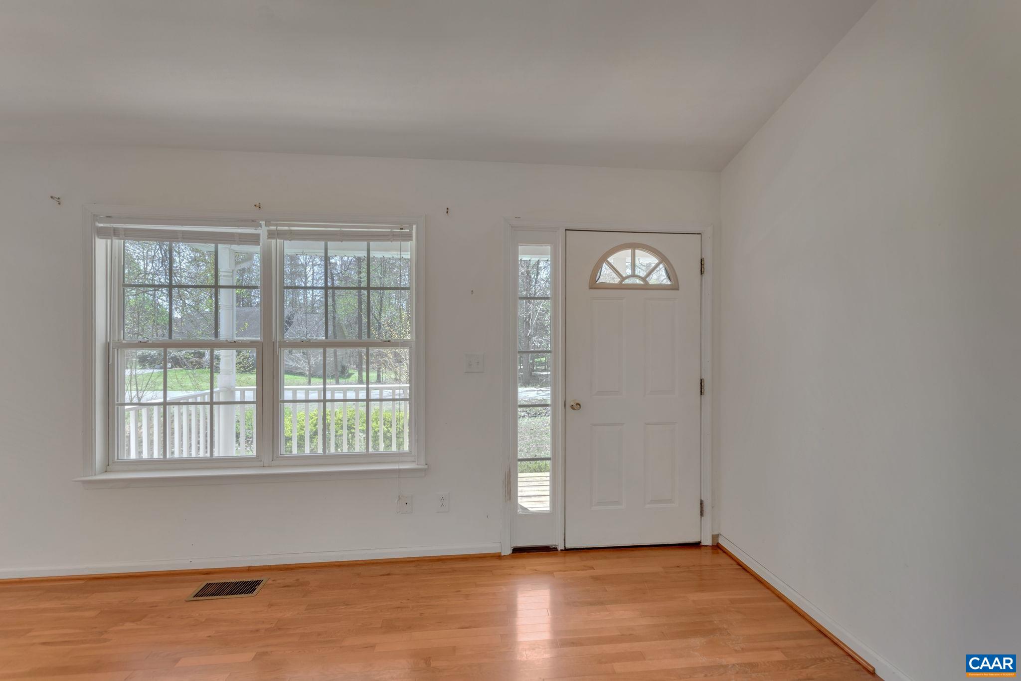 18 Loblolly Road Palmyra, VA 22963 - Photo 8 of 41 an empty room with wooden floor and windows
