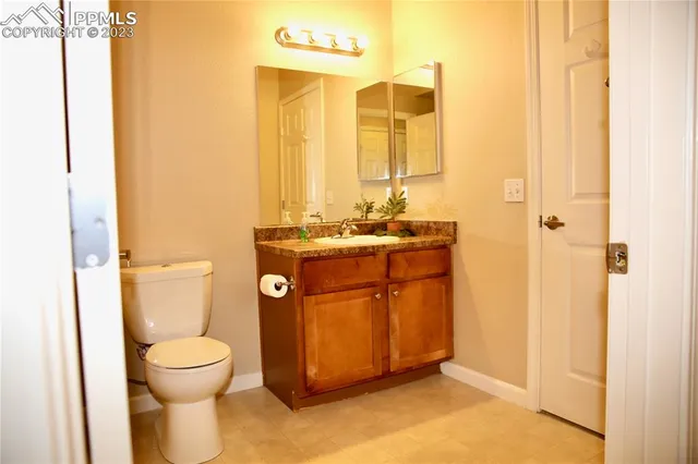 an empty room with a bathroom and a sink