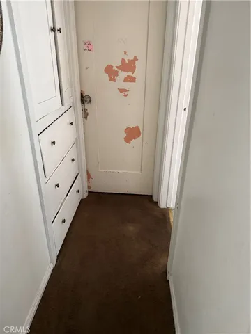 a room with dining table and windows