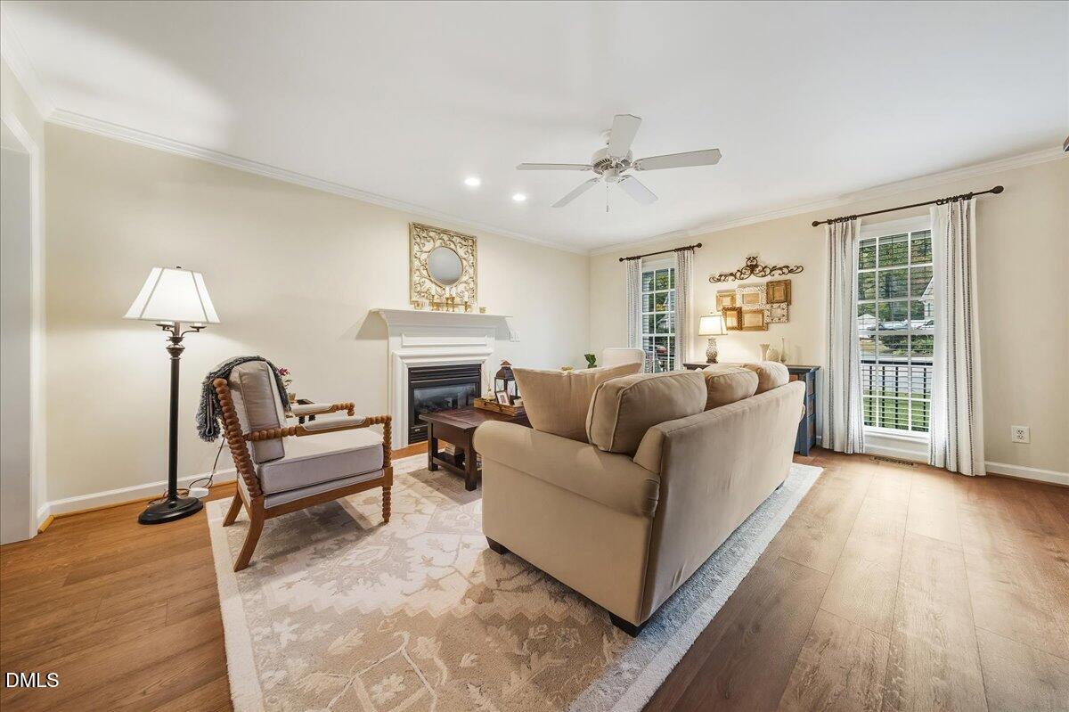 617 Rodney Bay Crossing Wake Forest, NC 27587 - Photo 16 of 36 a living room with furniture and a fireplace