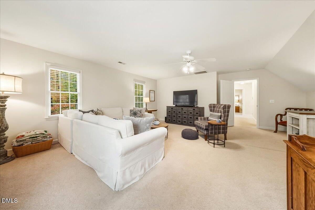 617 Rodney Bay Crossing Wake Forest, NC 27587 - Photo 18 of 36 a living room with furniture and a flat screen tv