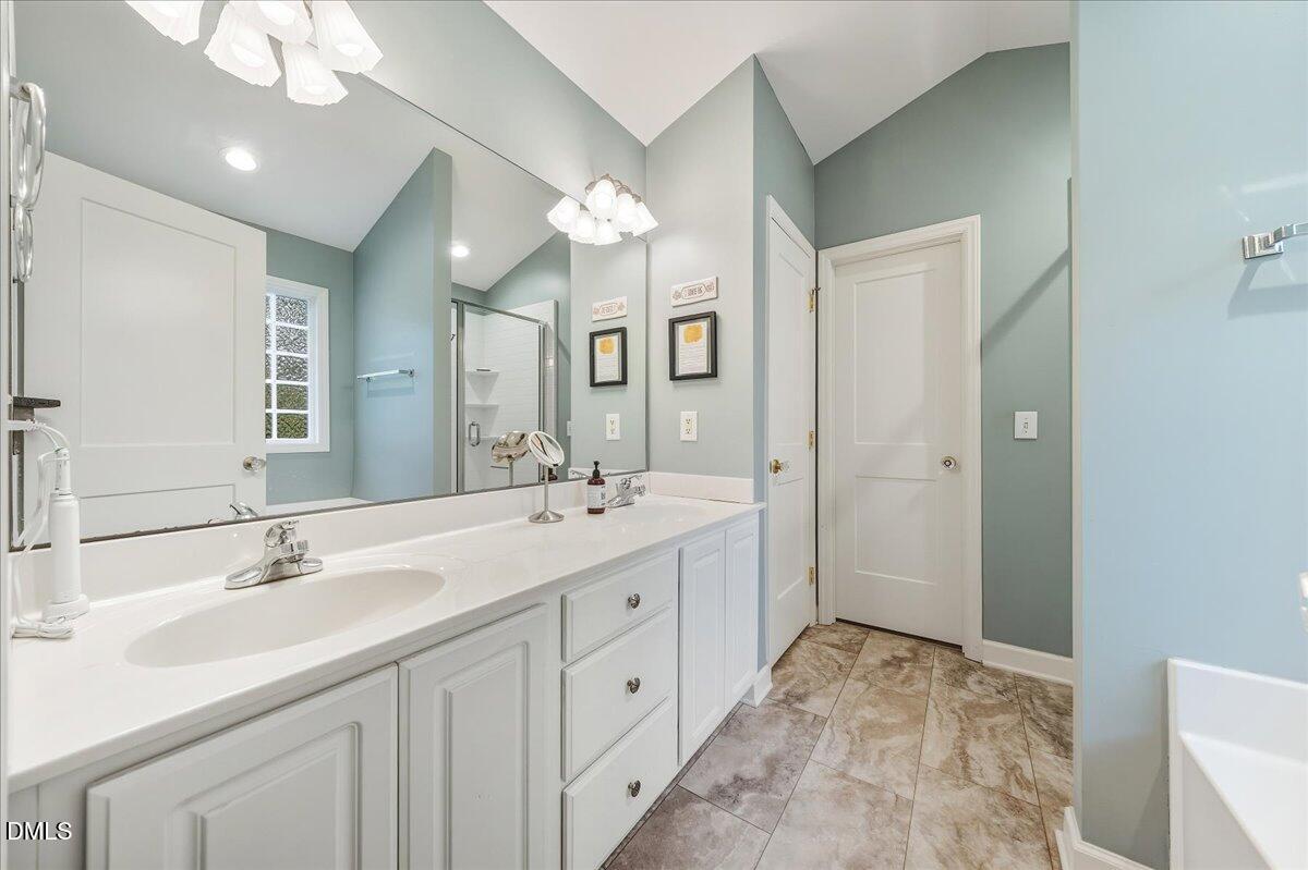 617 Rodney Bay Crossing Wake Forest, NC 27587 - Photo 21 of 36 a spacious bathroom with a double vanity sink mirror and double