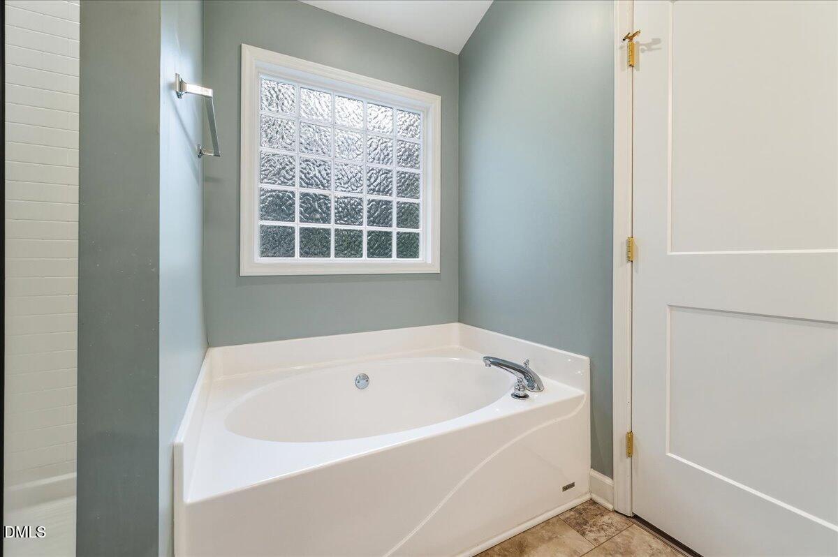 617 Rodney Bay Crossing Wake Forest, NC 27587 - Photo 23 of 36 a white bath tub sitting next to a window