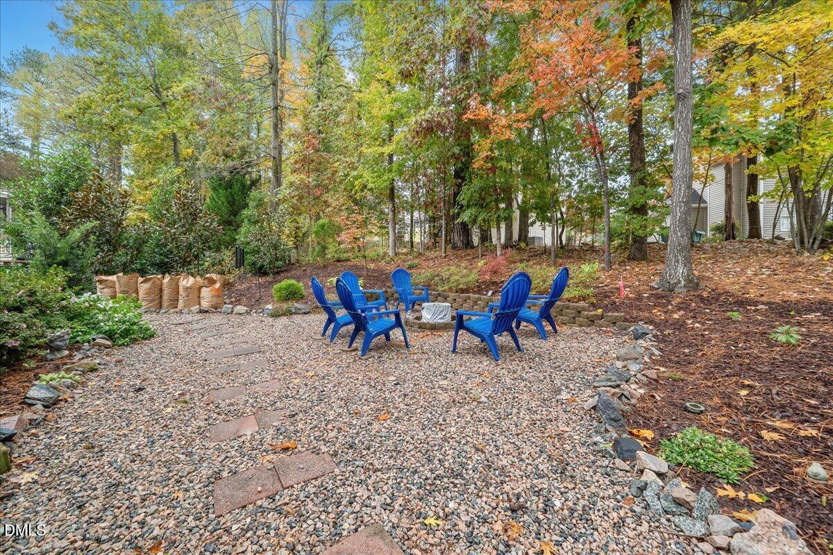 617 Rodney Bay Crossing Wake Forest, NC 27587 - Photo 32 of 36 a view of backyard with a table and chairs