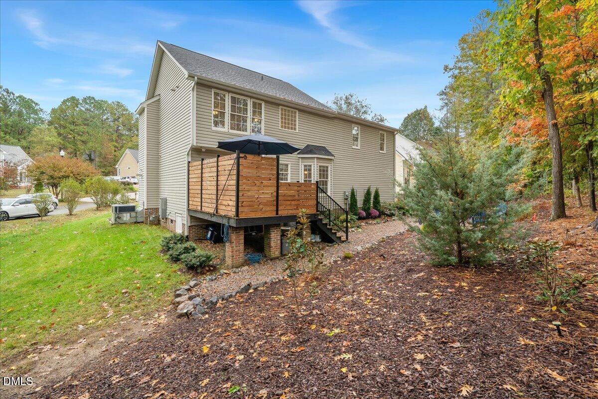 617 Rodney Bay Crossing Wake Forest, NC 27587 - Photo 33 of 36 a front view of a house with garden