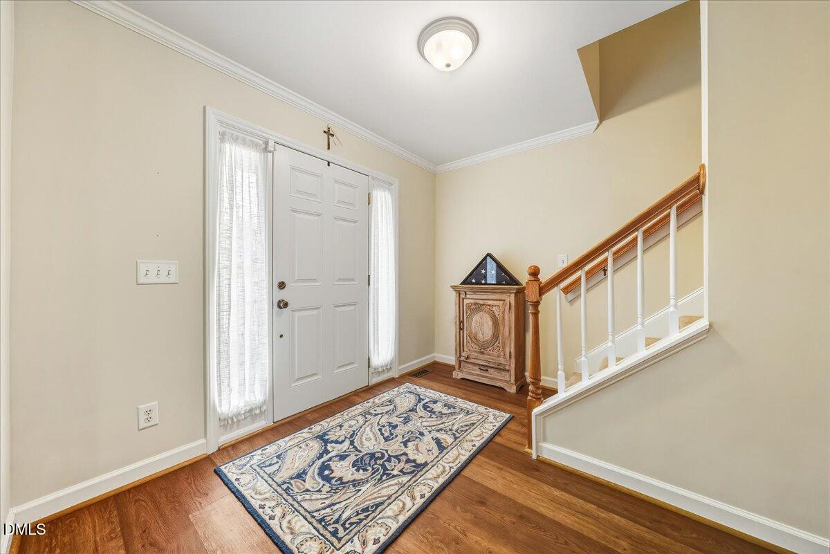 617 Rodney Bay Crossing Wake Forest, NC 27587 - Photo 4 of 36 a view of an entryway with wooden floor