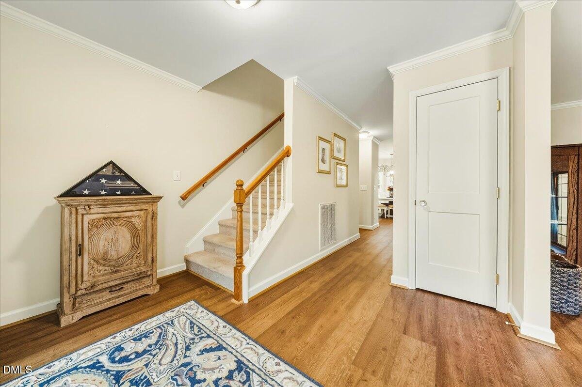 617 Rodney Bay Crossing Wake Forest, NC 27587 - Photo 5 of 36 a view of front door with wooden floor and a rug