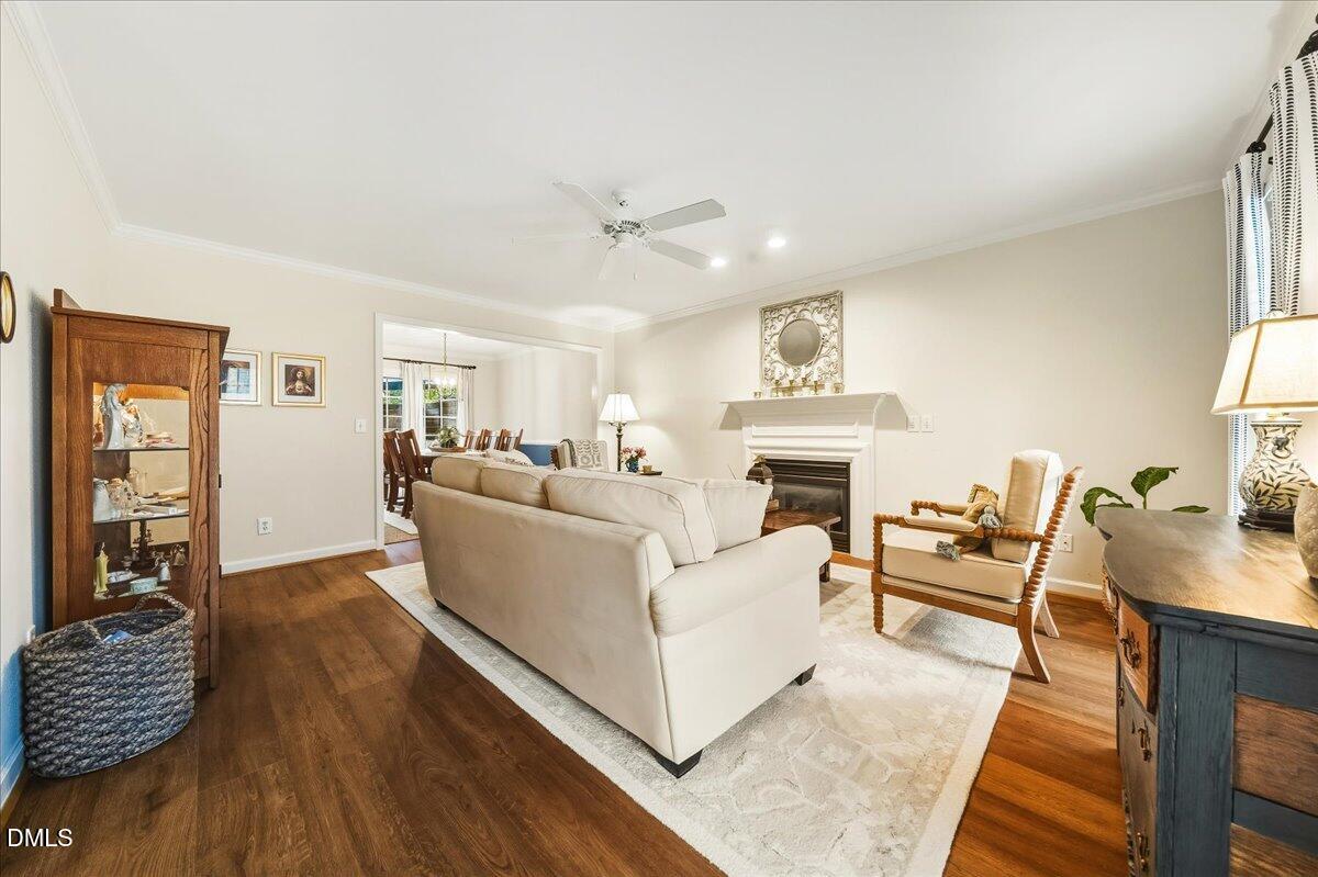 617 Rodney Bay Crossing Wake Forest, NC 27587 - Photo 7 of 36 a living room with furniture and a fireplace