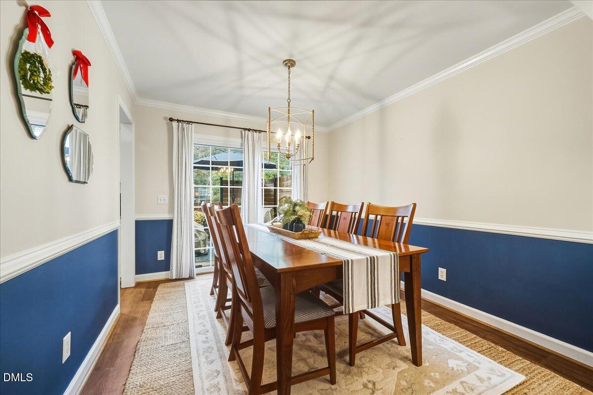 617 Rodney Bay Crossing Wake Forest, NC 27587 - Photo 8 of 36 a view of a dining room with furniture window and wooden floor