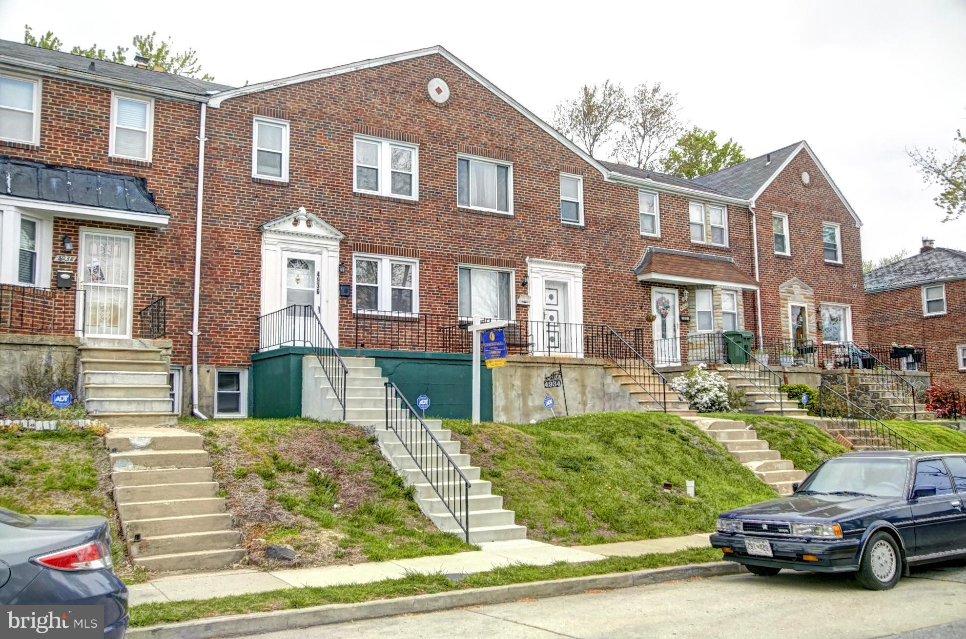 4936 West Hills Road Baltimore, MD 21229 - Photo 1 of 18 a view of a city that has lots of cars parked on the road