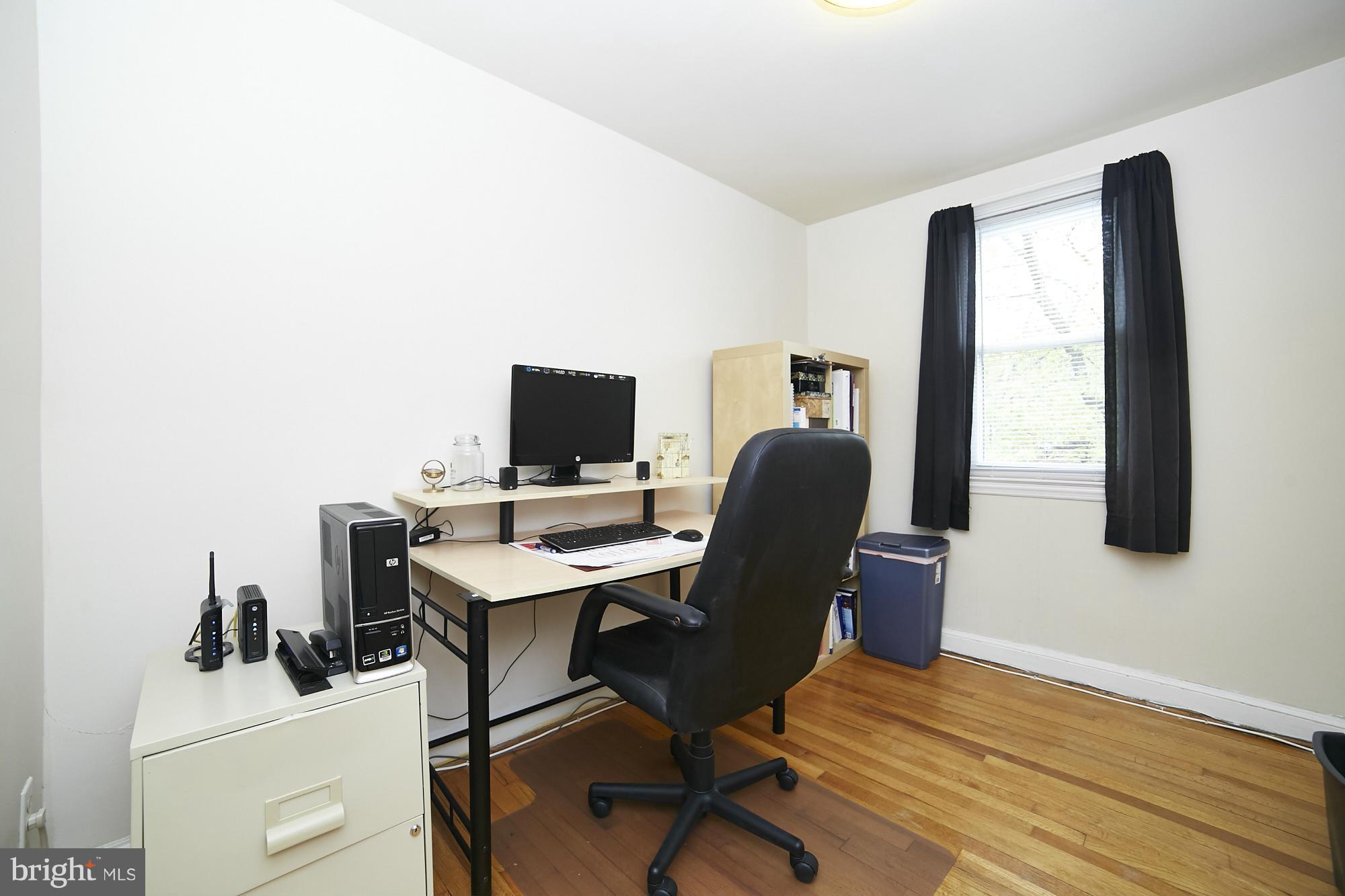 4936 West Hills Road Baltimore, MD 21229 - Photo 14 of 18 a view of a workspace with furniture and a window