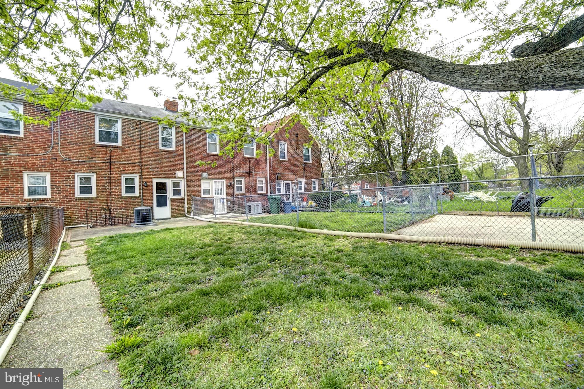 4936 West Hills Road Baltimore, MD 21229 - Photo 17 of 18 a view of a house with a yard