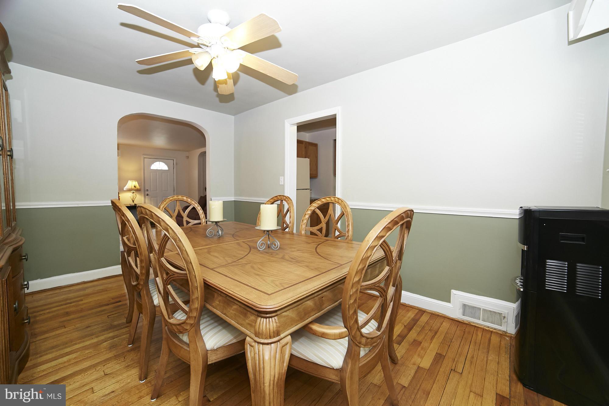 4936 West Hills Road Baltimore, MD 21229 - Photo 5 of 18 a view of a dining room with furniture and wooden floor