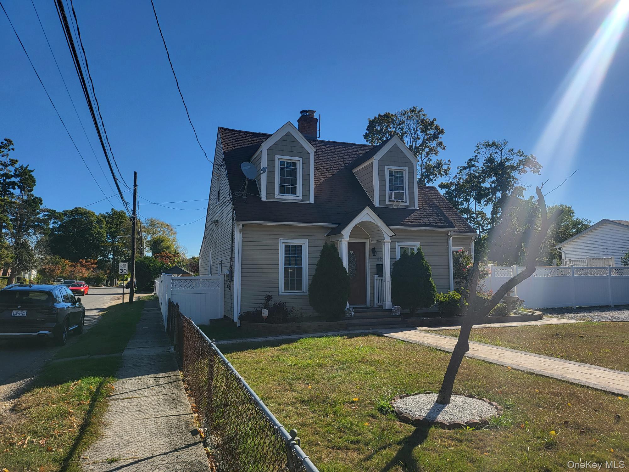 61 Wheeler Road Central Islip, NY 11722 - Photo 1 of 26 a front view of a house with garden