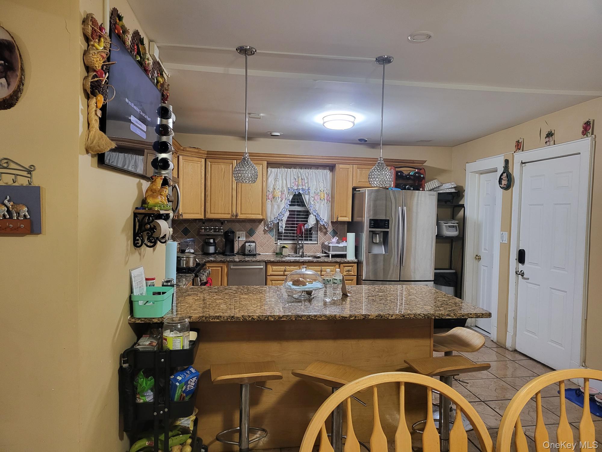 61 Wheeler Road Central Islip, NY 11722 - Photo 11 of 26 a kitchen with a table and chairs in it