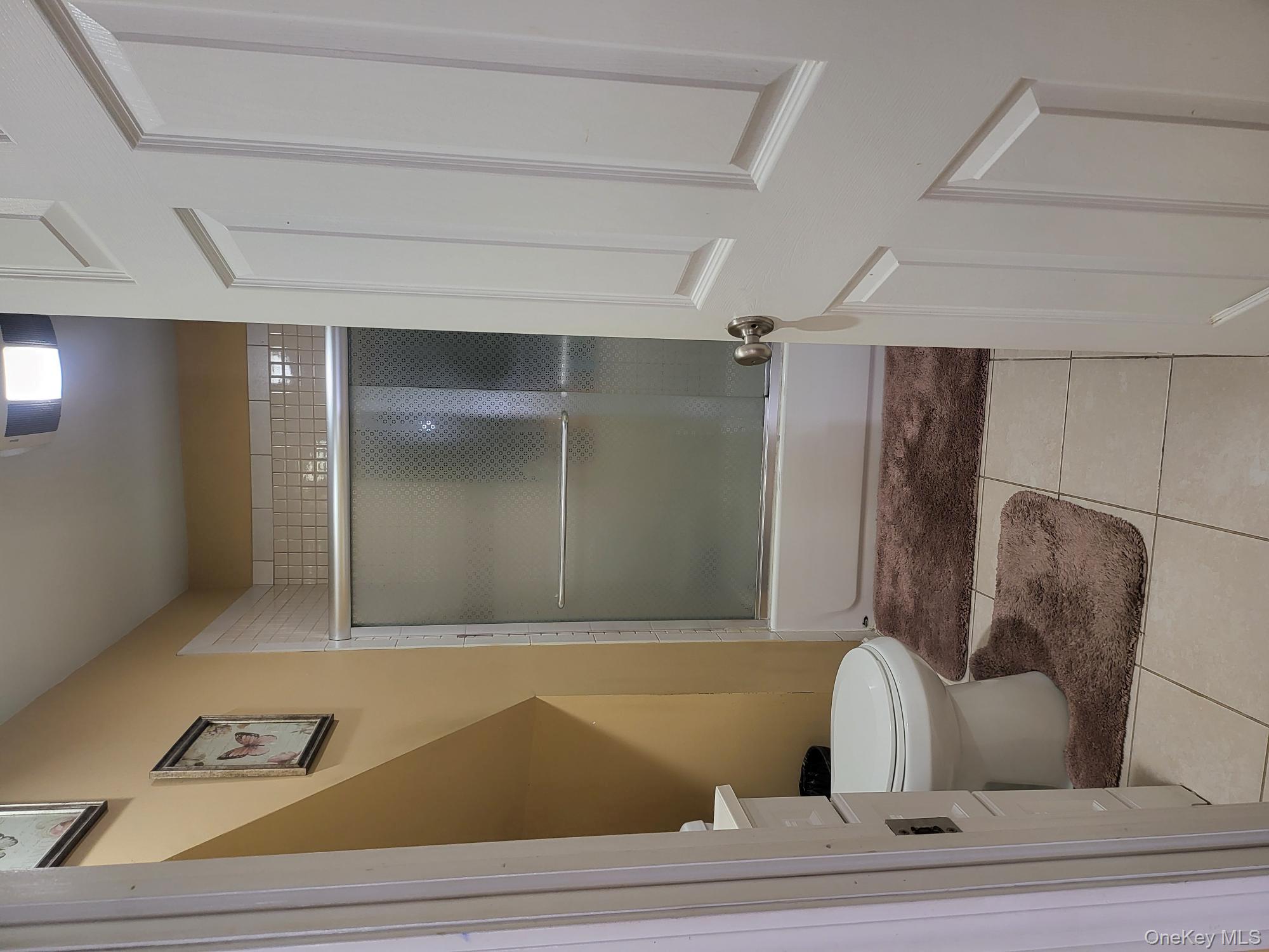 61 Wheeler Road Central Islip, NY 11722 - Photo 16 of 26 a bathroom with a toilet and a shower