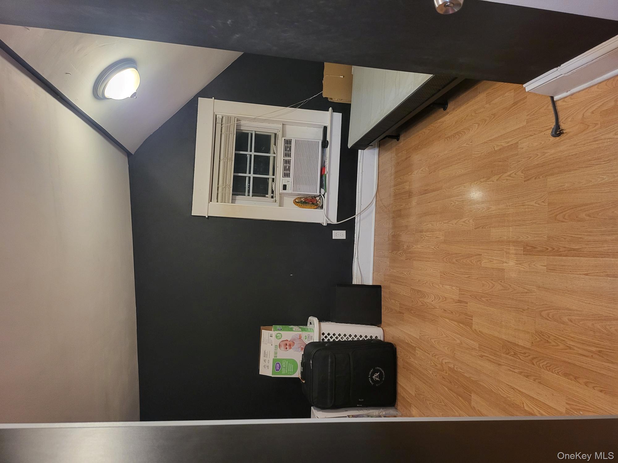 61 Wheeler Road Central Islip, NY 11722 - Photo 19 of 26 a view of a room with gym equipment