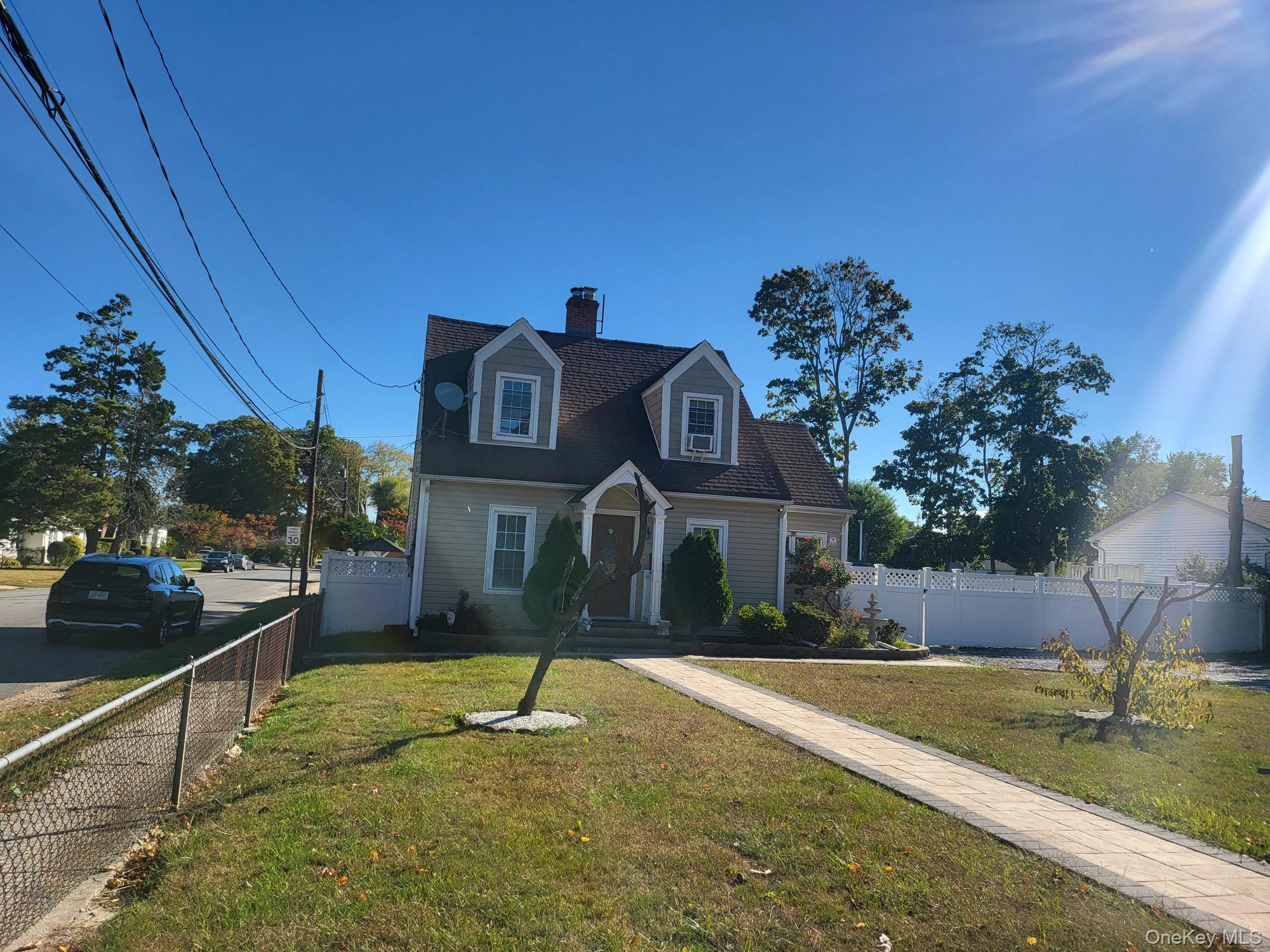 61 Wheeler Road Central Islip, NY 11722 - Photo 2 of 26 a front view of a house with a yard