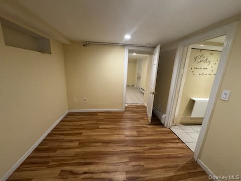 61 Wheeler Road Central Islip, NY 11722 - Photo 23 of 26 a view of a room with wooden floor and stairs