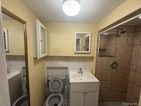 61 Wheeler Road Central Islip, NY 11722 - Photo 24 of 26 a bathroom with a sink a toilet and shower