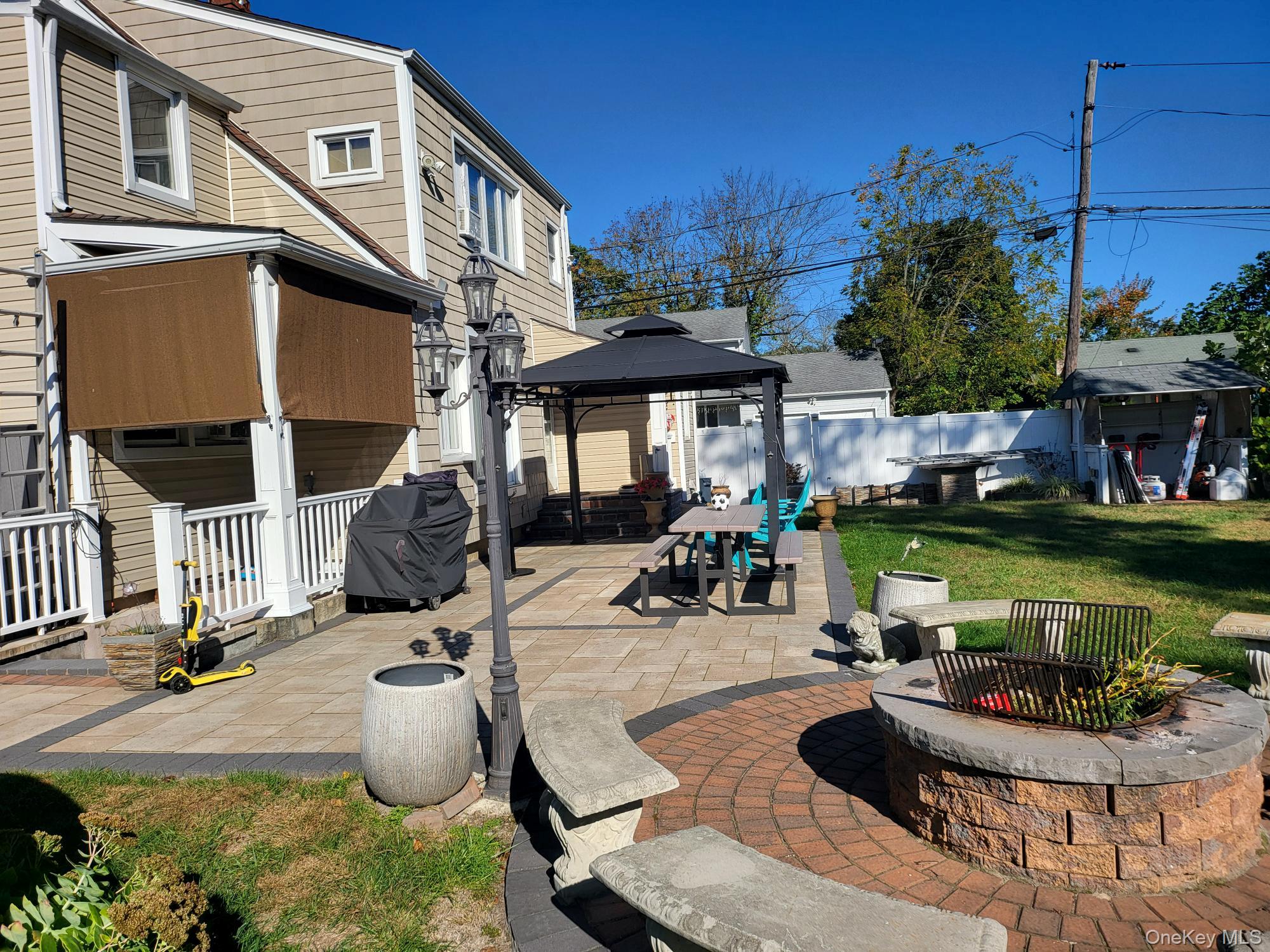 61 Wheeler Road Central Islip, NY 11722 - Photo 7 of 26 a view of a house with swimming pool and sitting area