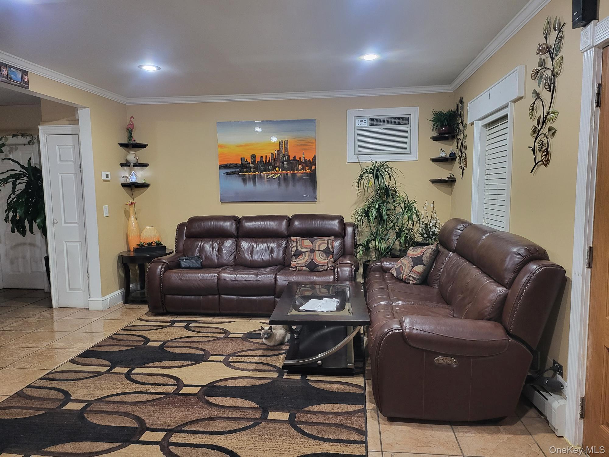 61 Wheeler Road Central Islip, NY 11722 - Photo 8 of 26 a living room with furniture and a flat screen tv