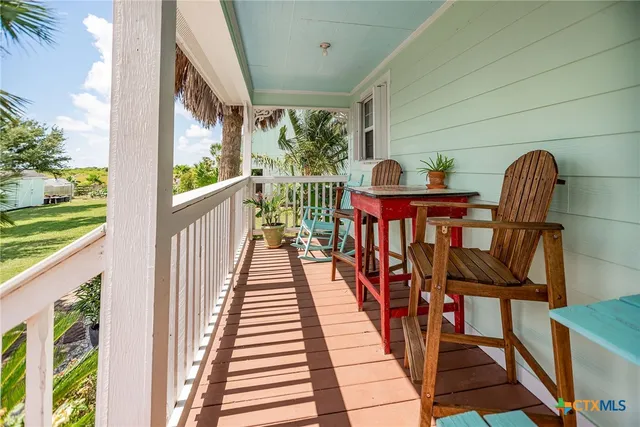 a view of a balcony with chairs