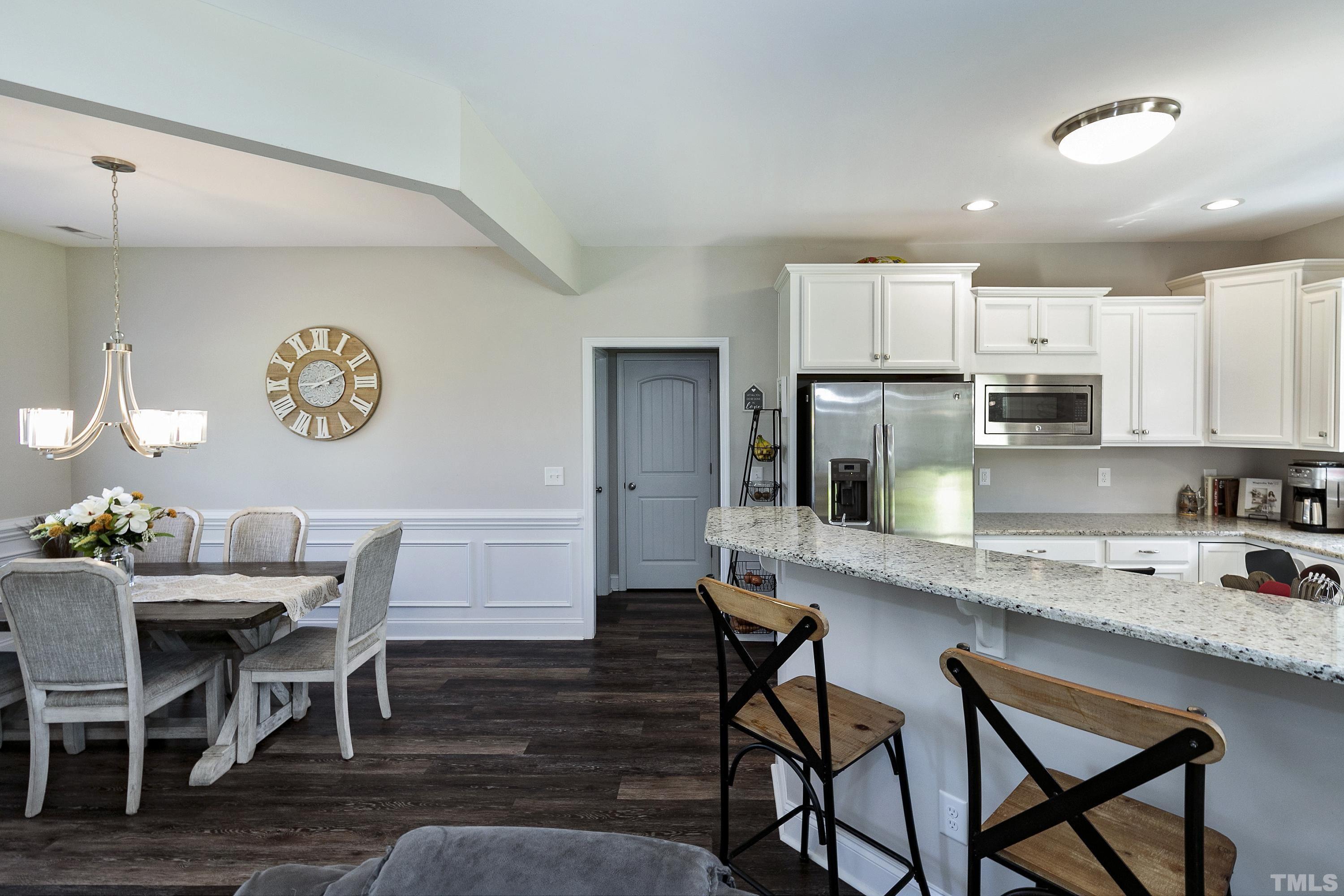 7163 Highway 210 Bunnlevel, NC 28323 - Photo 15 of 54 a dining room with furniture and wooden floor