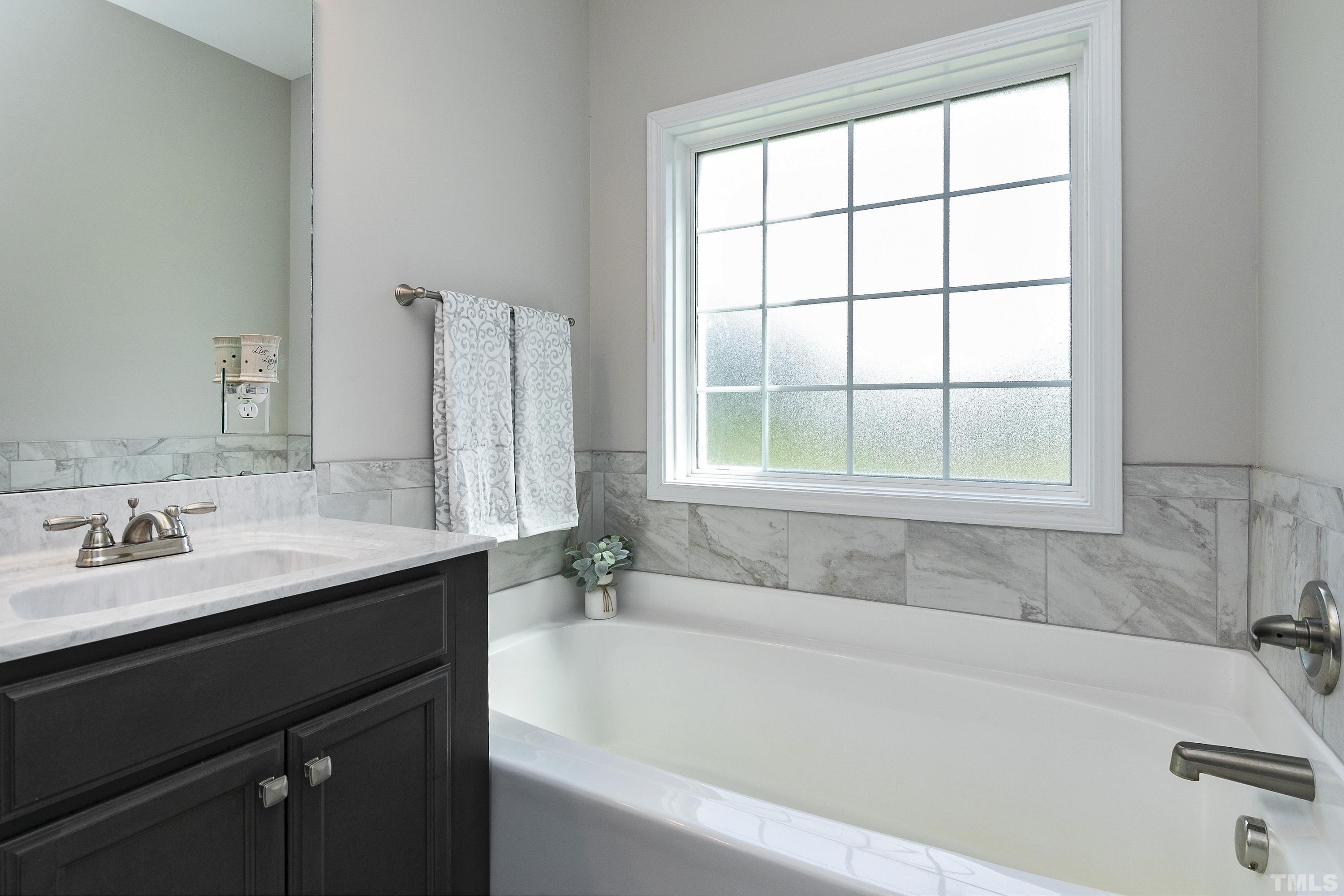 7163 Highway 210 Bunnlevel, NC 28323 - Photo 25 of 54 a white bath tub sitting next to a white sink