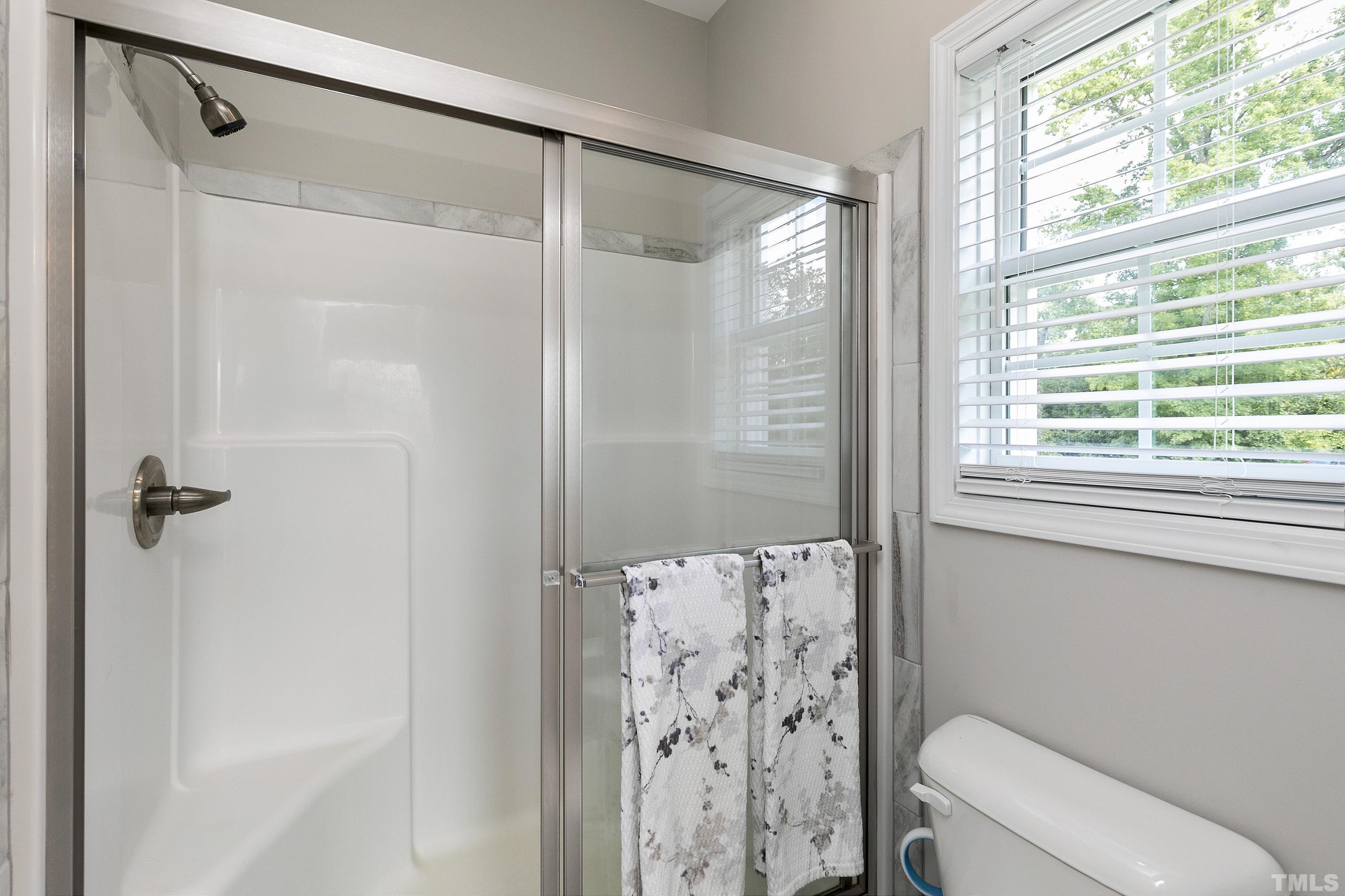 7163 Highway 210 Bunnlevel, NC 28323 - Photo 28 of 54 a bathroom with a shower and a toilet