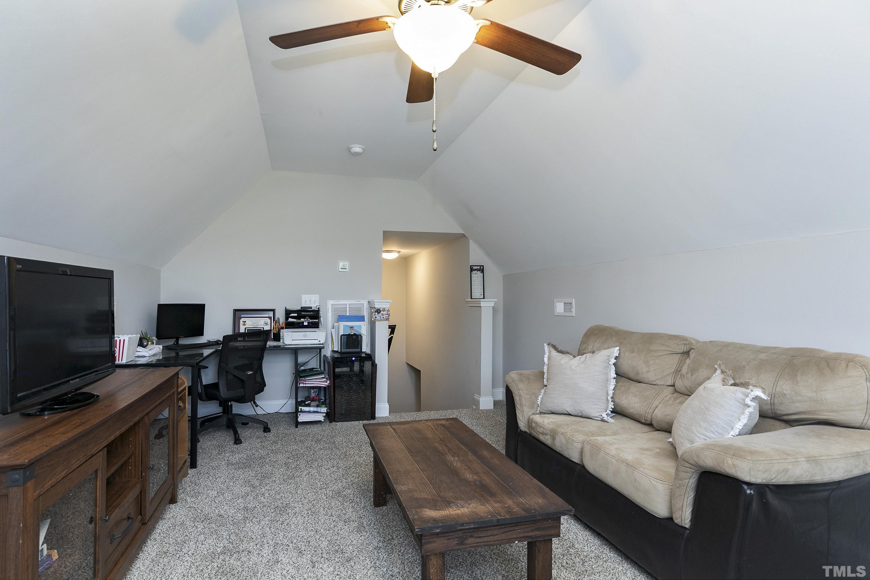 7163 Highway 210 Bunnlevel, NC 28323 - Photo 37 of 54 a living room with furniture and a flat screen tv