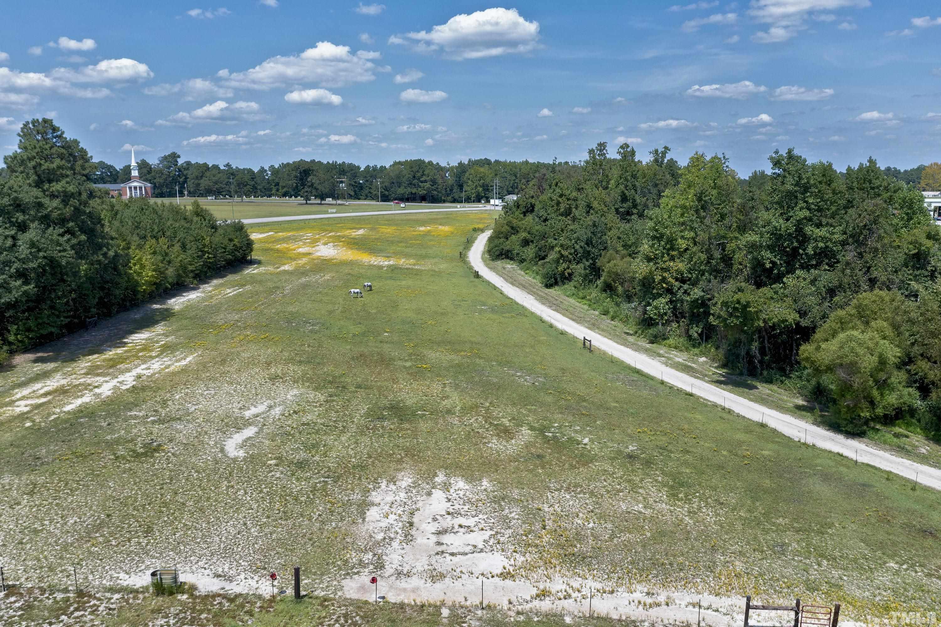 7163 Highway 210 Bunnlevel, NC 28323 - Photo 46 of 54 a view of a lake from a yard