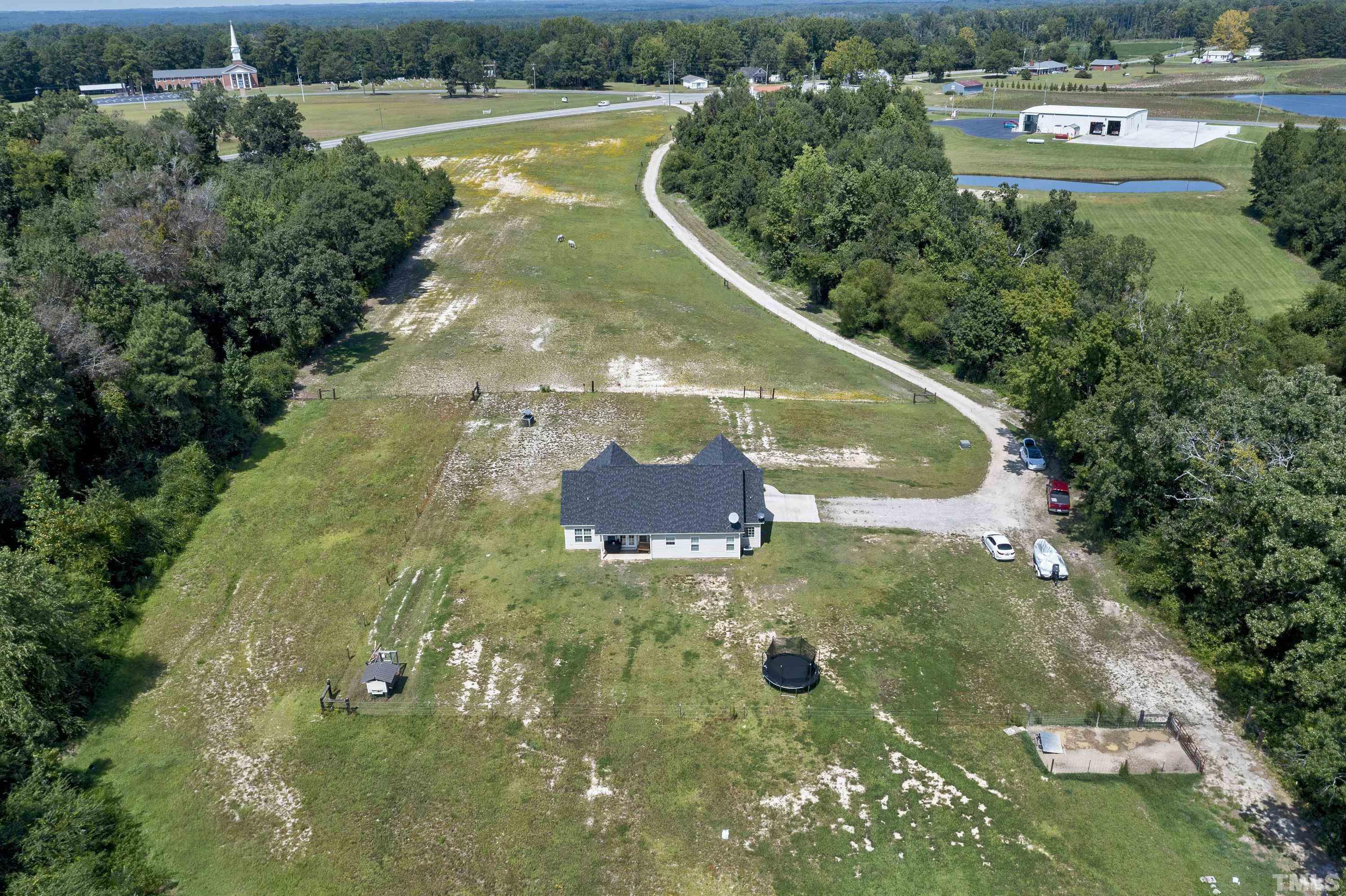7163 Highway 210 Bunnlevel, NC 28323 - Photo 50 of 54 a view of a lake with a yard