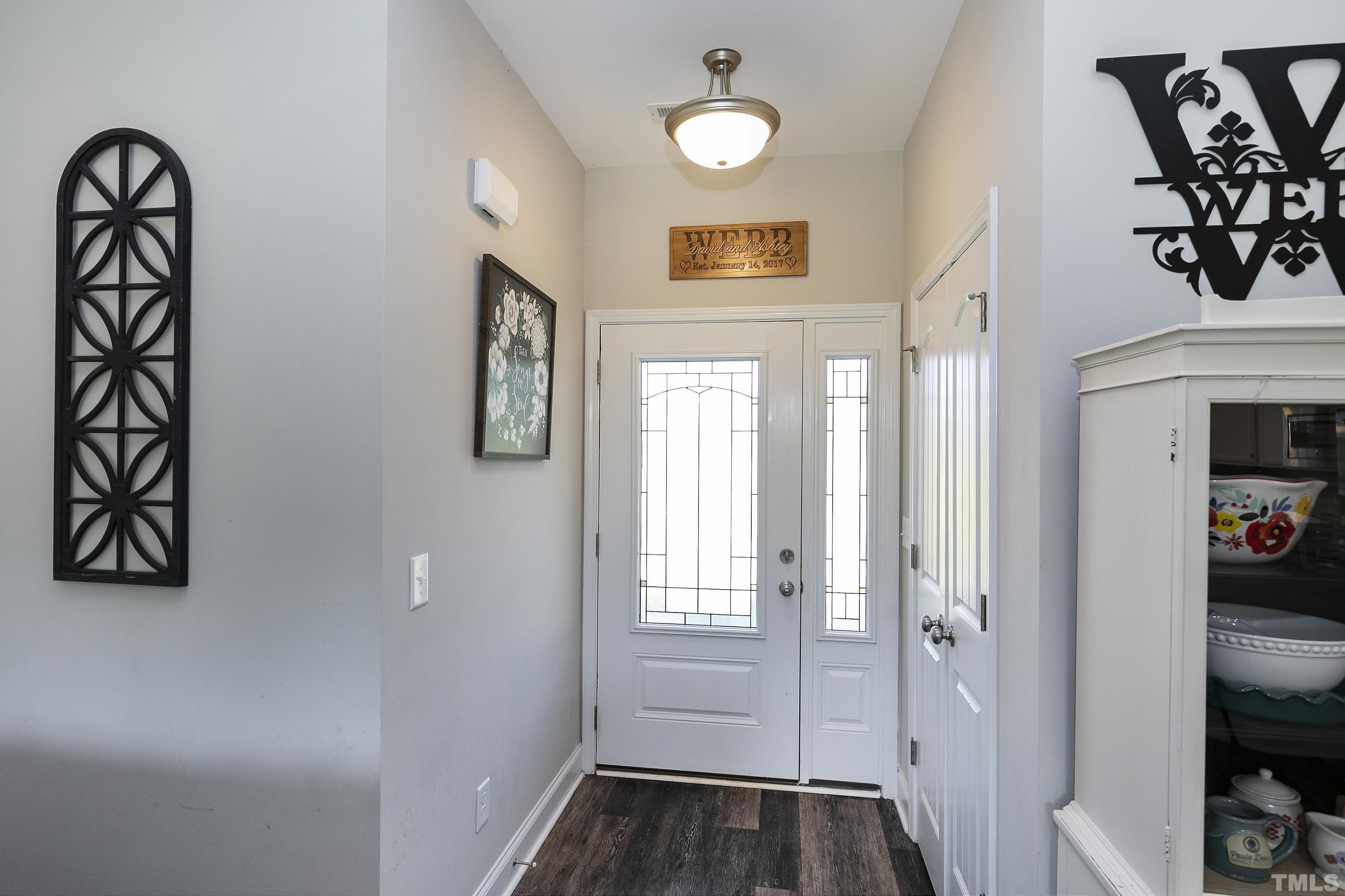 7163 Highway 210 Bunnlevel, NC 28323 - Photo 10 of 54 a view of entryway with window and wooden floor