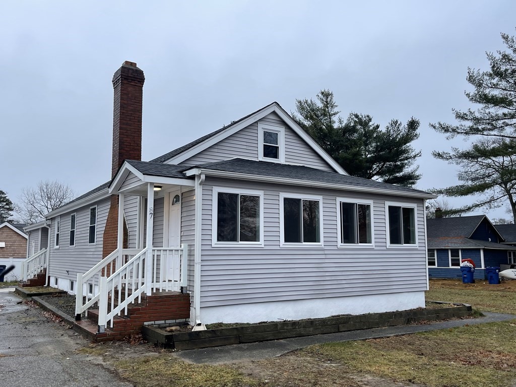 87 Cohasset Road Wareham, MA 02532 - Photo 1 of 16 a front view of a house with a garden