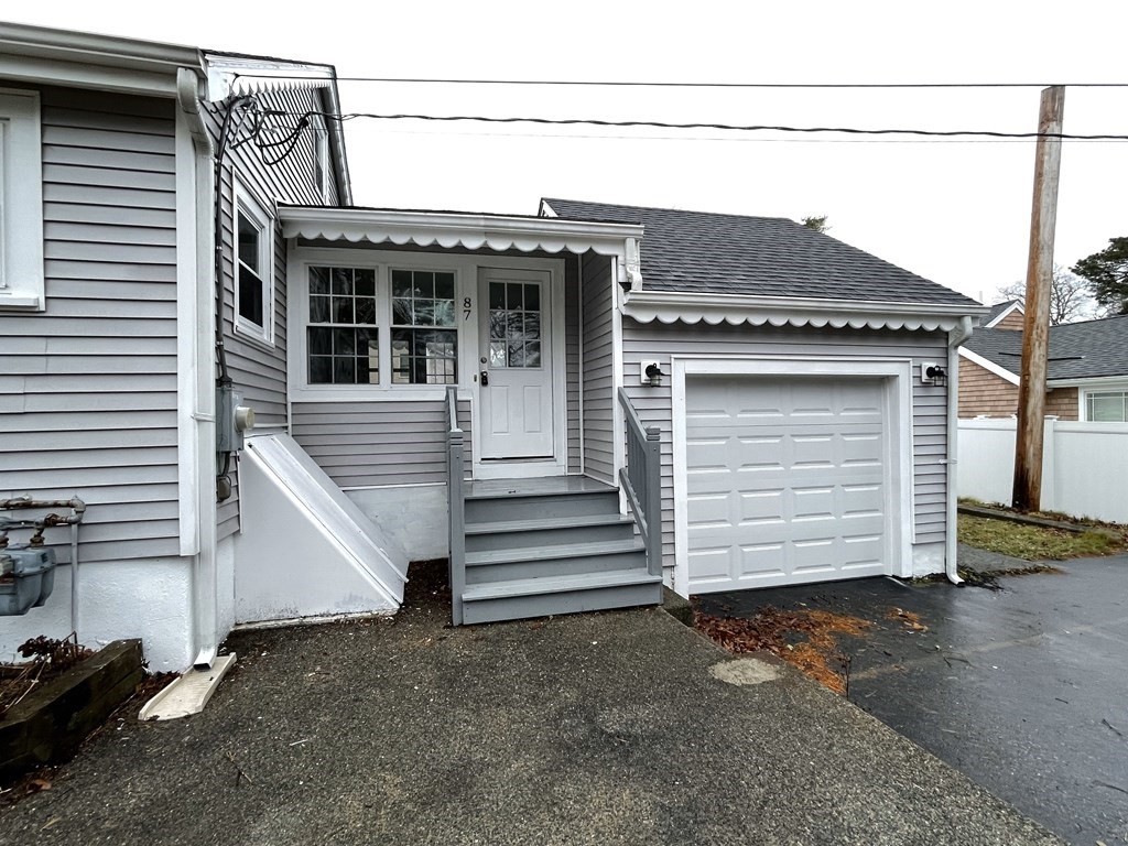 87 Cohasset Road Wareham, MA 02532 - Photo 3 of 16 a view of a house with a garage