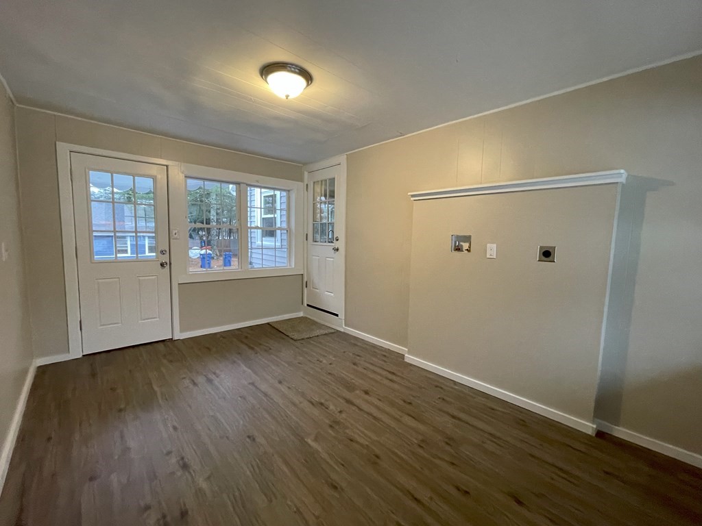 87 Cohasset Road Wareham, MA 02532 - Photo 4 of 16 an empty room with wooden floor and windows