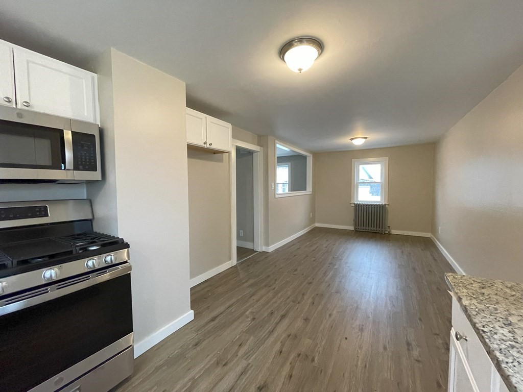 87 Cohasset Road Wareham, MA 02532 - Photo 6 of 16 a view of kitchen and hall with wooden floor