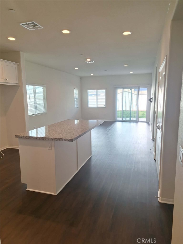 35170 Webb Place Beaumont, CA 92223 - Photo 3 of 21 a view of an empty room with window and wooden floor