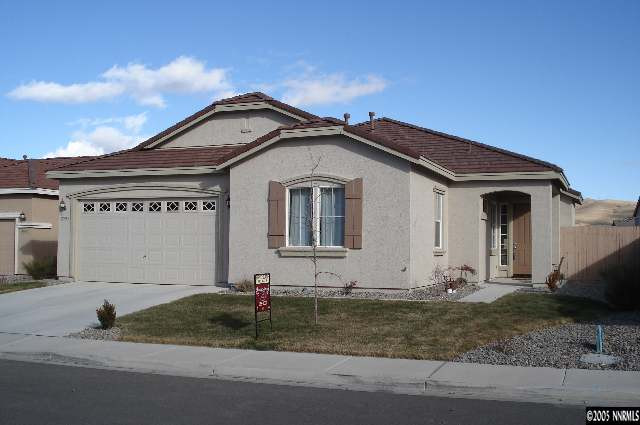 2595 Perryville Drive Reno, NV 89521 - Photo 1 of 9 a front view of a house with garage